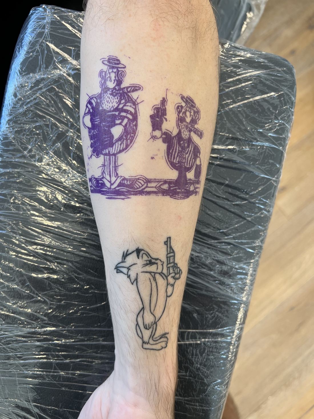 Tattoo: Black & grey sketch — Cartoon characters with pistols