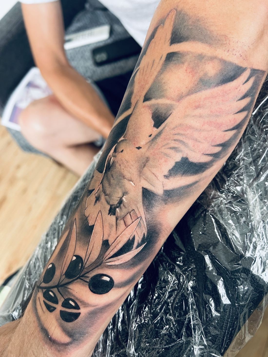 Tattoo: Black & grey — Dove and olive branch
