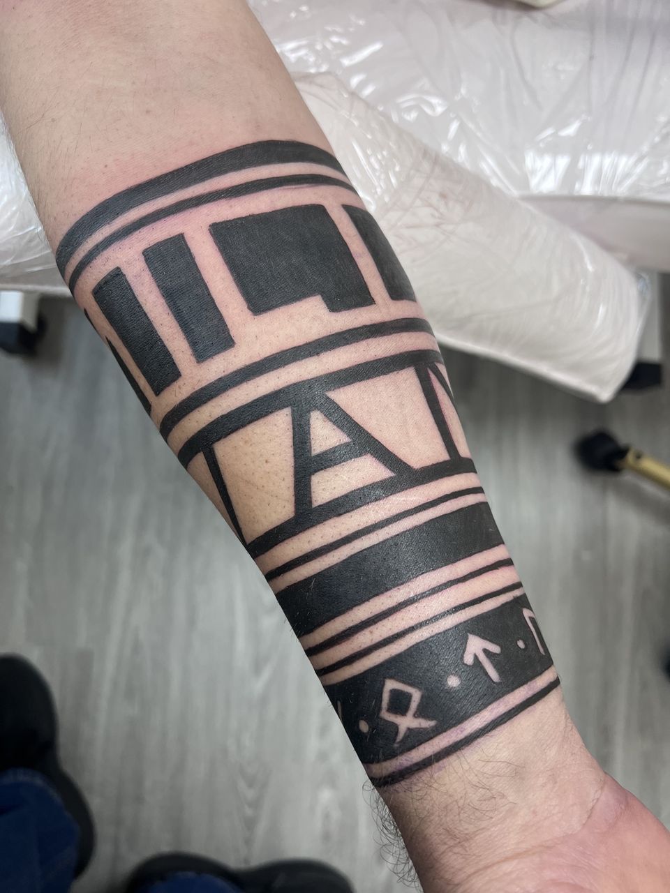 Tattoo: Blackwork ornamental — Tribal armband with runes